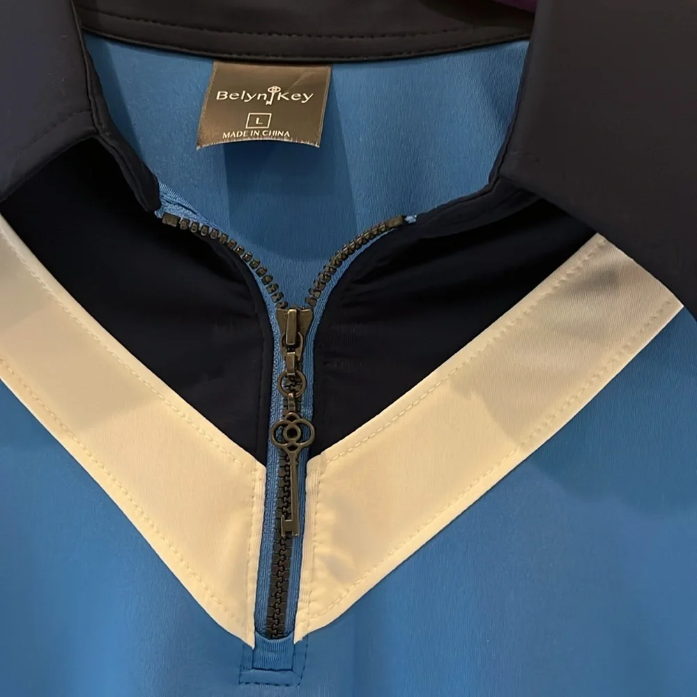Blue Sleeveless golf Top with navy and White Accents. - Picture 2 of 5
